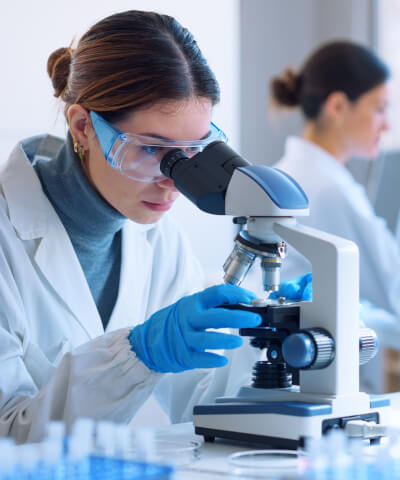 Researcher with microscope
